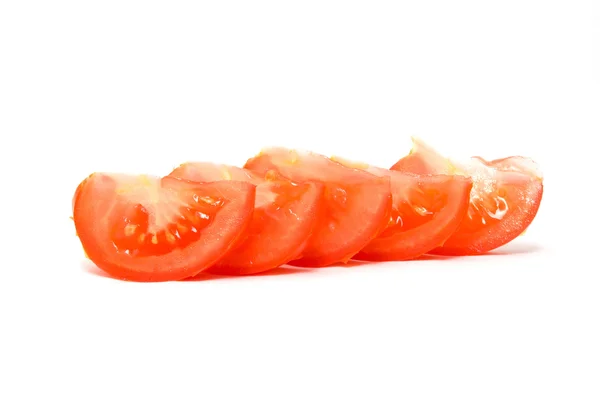 Rodajas de tomate, lóbulos en el blanco — Foto de Stock