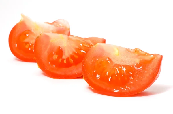Fette di pomodoro, lobuli sul bianco — Foto Stock