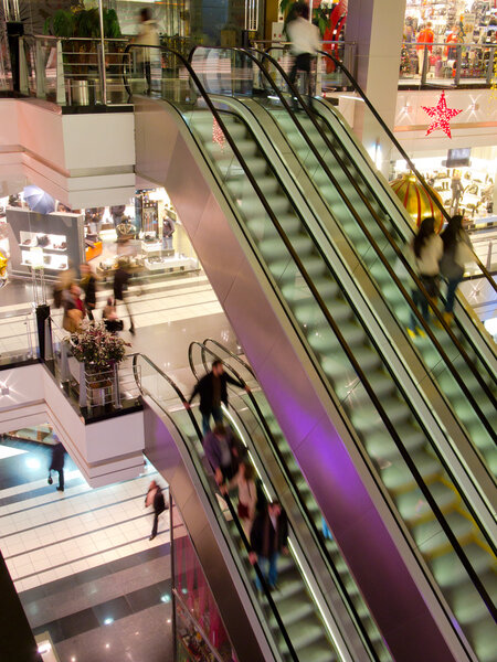 In the multilevel mall, motion blurred