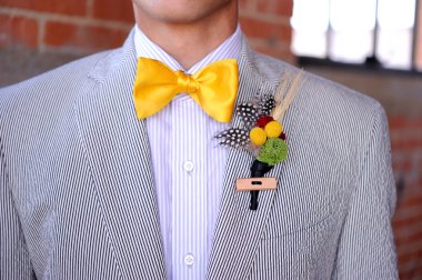 Seersucker Suit with yellow bowtie and boutonniere clipart