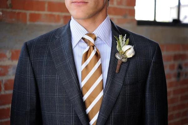 Gray Plaid suit with tan stripes and boutonniere — Stock Photo, Image