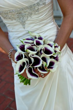 Closeup of a bride holding bouquet clipart