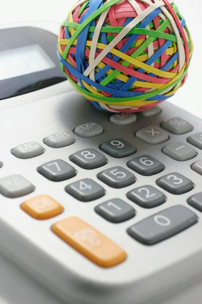 Rubber band Ball on Calculator — Stock Photo, Image