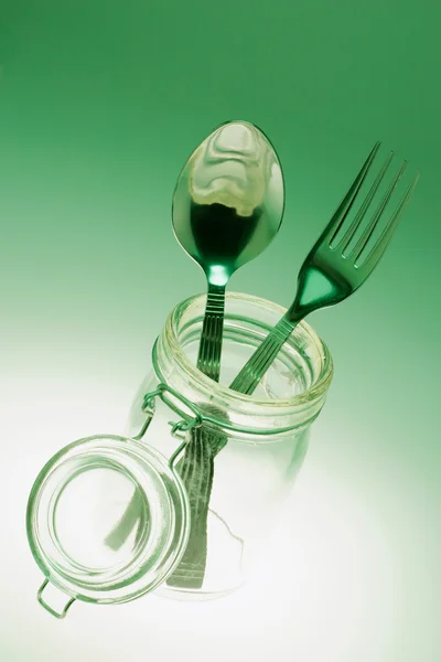 Tenedor y cuchara en tarro de vidrio —  Fotos de Stock