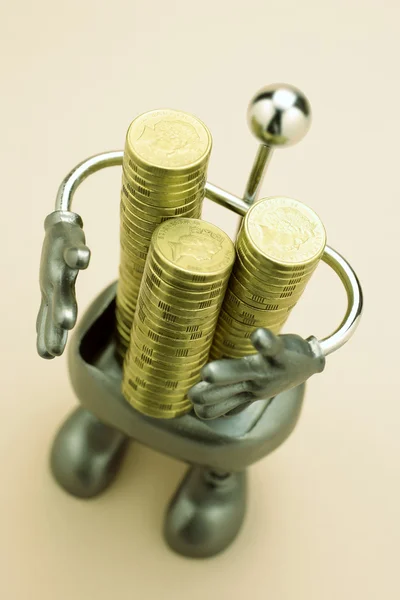 Figura com moedas — Fotografia de Stock