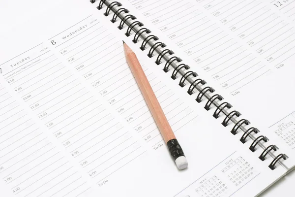Pencil on Pocket Planner — Stock Photo, Image