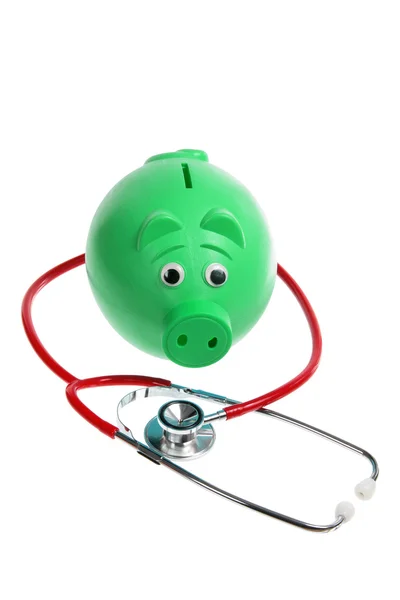 Piggy Bank and Stethoscope Stock Image