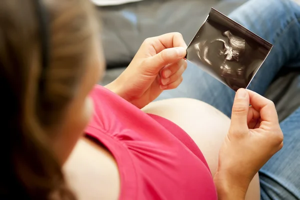 stock image Pregnant woman with ultrasound picture