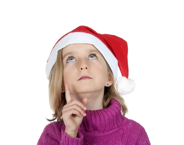Noel Baba şapkası ile küçük kız — Stok fotoğraf