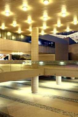 Modern hall in city downtown night clipart