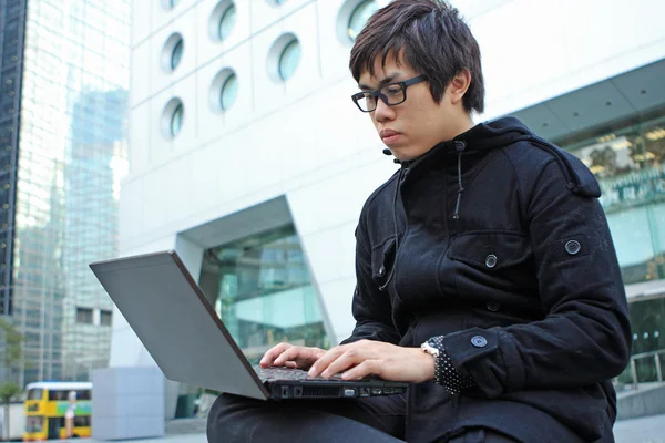 Man using computer outdoor — Stock Photo, Image