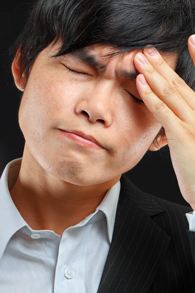 Tired business man holding his head — Stock Photo, Image