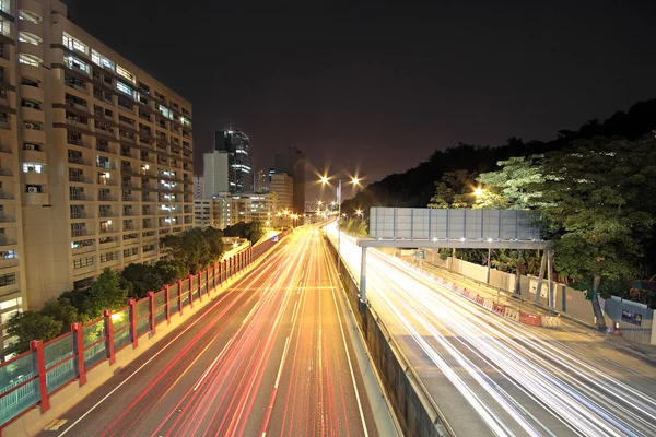 stock image Traffic through downtown at night