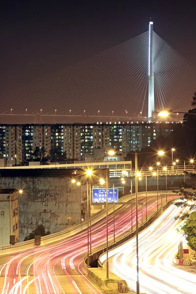 stock image Traffic through downtown at night