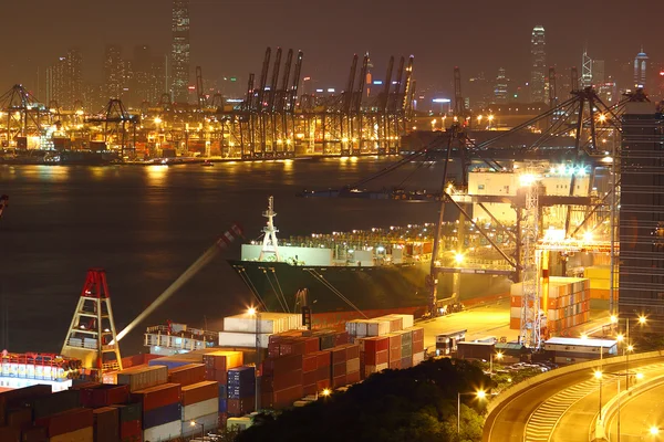 Container terminal at night in city — Stock Photo, Image