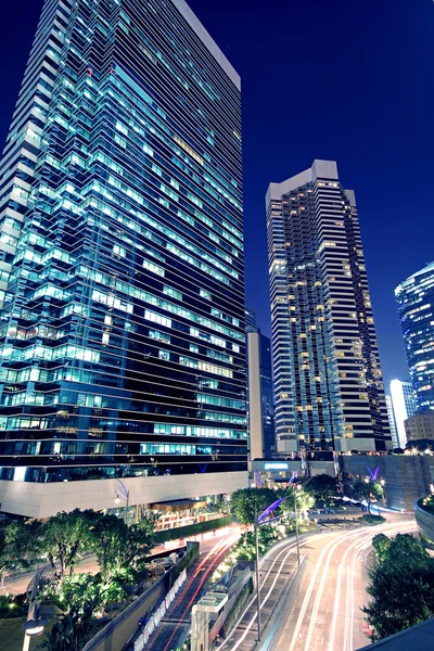 Tall office buildings by night — Stock Photo, Image
