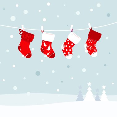Christmas stockings in winter nature - white and red clipart