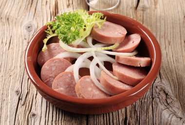 Sliced sausages and onion clipart