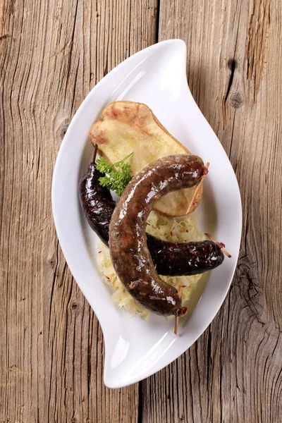 Stock image Sausages, sauerkraut and baked potato