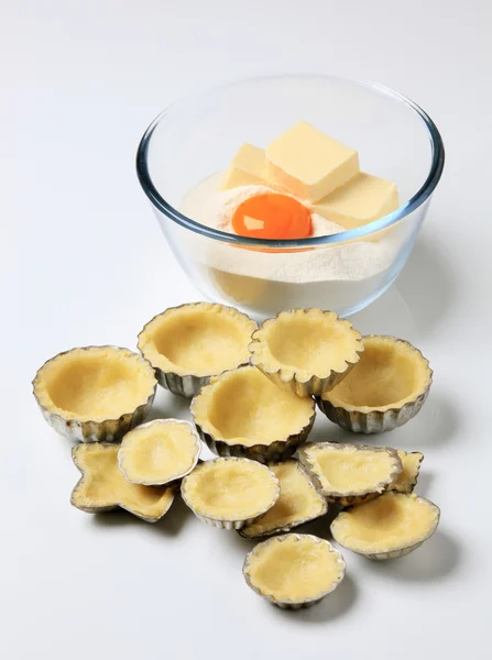 stock image Raw dough in tartlet pans