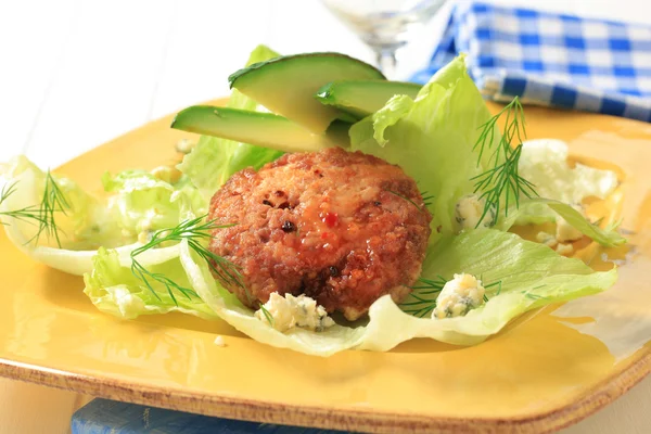 Meat patty on lettuce leaves — Stock Photo, Image
