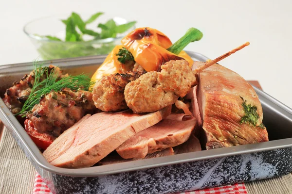 Roast pork meat in a baking pan — Stock Photo, Image