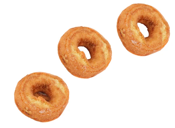 Three Plain Doughnuts Diagonally — Stock Photo, Image