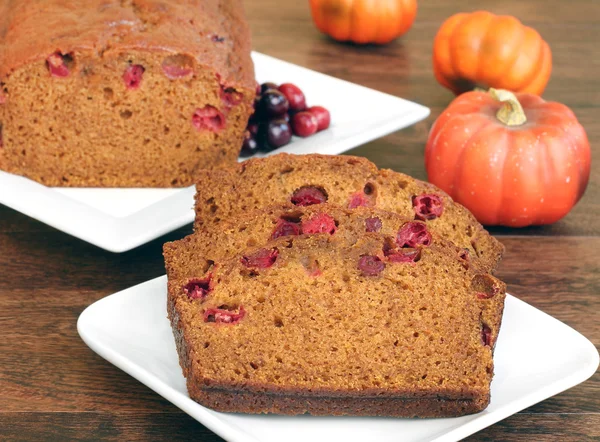 Pumpkin Cranberry Bread, sliced and whole. — Stock Photo, Image
