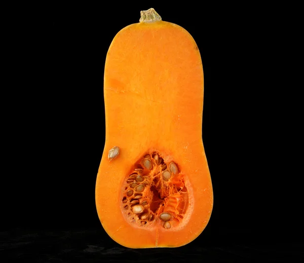 stock image Stillife with a fresh pumpkin on black background