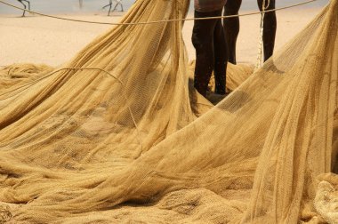 Fishing net on the ocean. Kovalam, Kerala, South India clipart