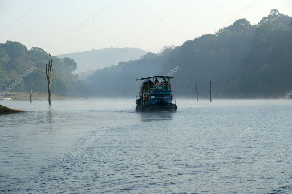 Boat on forest lake, Periyar National Park, Kerala, India