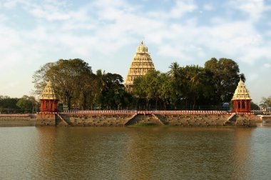 Traditional Hindu temple on lake clipart