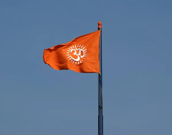 Flag with a sign Om or Aum --is a sacred, mystical syllable in t — Stock Photo, Image