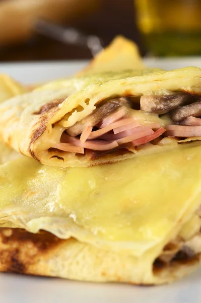 stock image Crepes filled with ham, cheese and mushroom