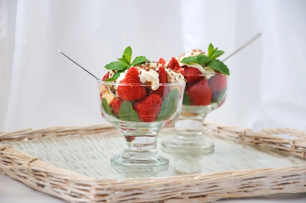 Strawberries with biscuit pieces with mint whipped cream under — Stock Photo, Image