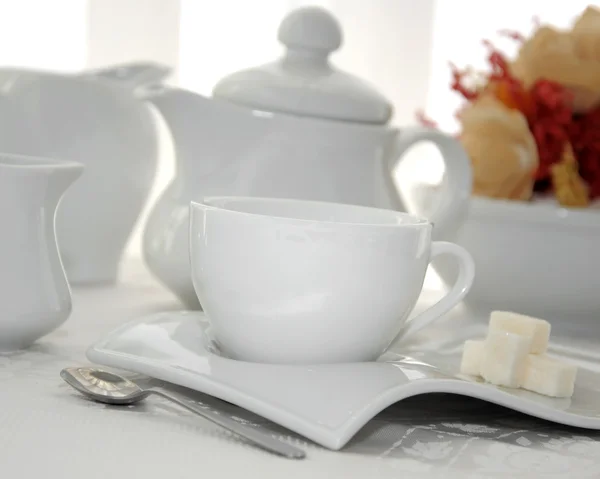 A cup of tea with sugar cubes — Stock Photo, Image