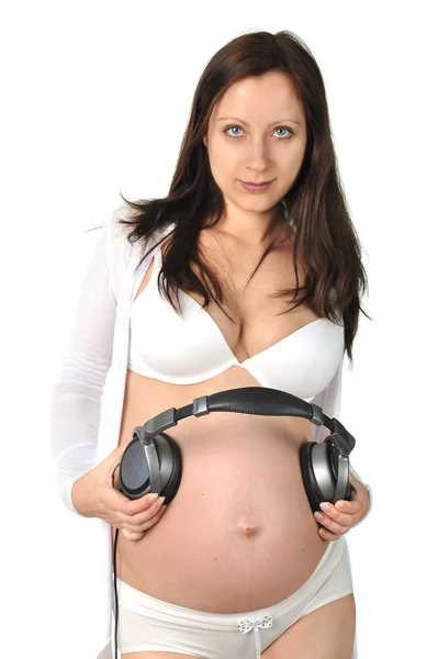 Toekomstige baby luistert naar muziek — Stockfoto