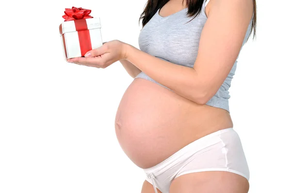 Těhotná žena s dárkem — Stock fotografie