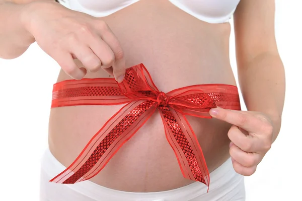 Red ribbon around belly — Stock Photo, Image