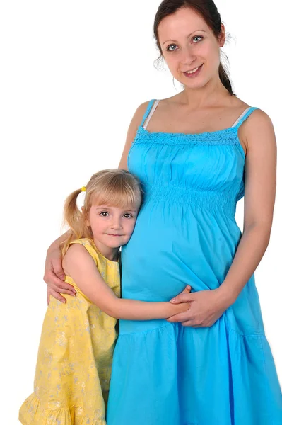 Vrouw in blauwe jurk met dochter. — Stockfoto