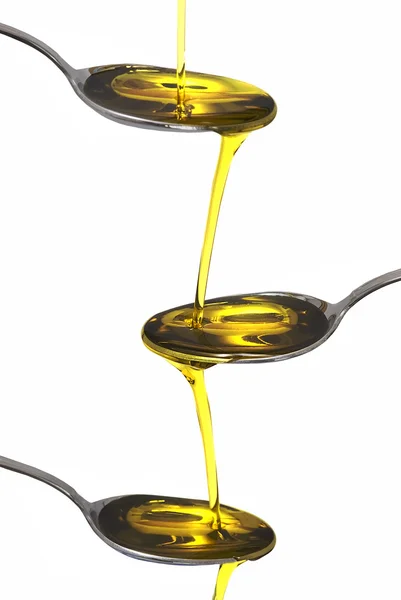 Tre cucchiai con olio d'oliva . — Foto Stock