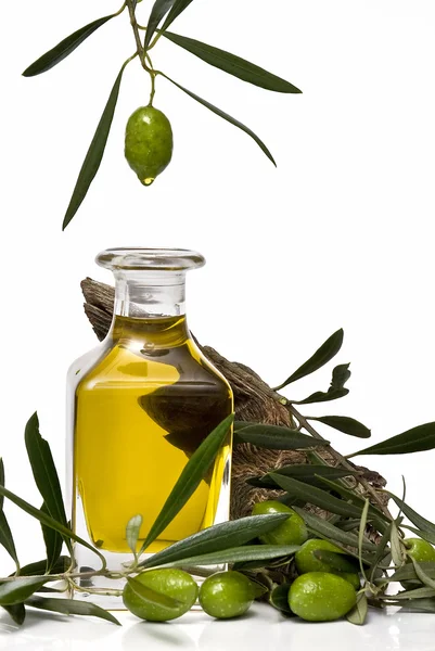 Olive oil dripping into a bottle. — Stockfoto