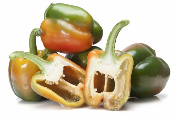 Fresh peppers and two halves. — Stock Photo, Image