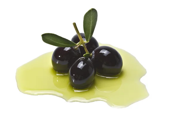 Vier schwarze Oliven. — Stockfoto