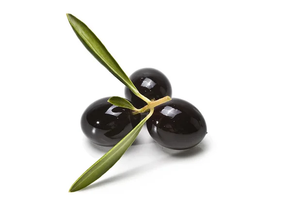 Black olives with leaves. — Stock Photo, Image