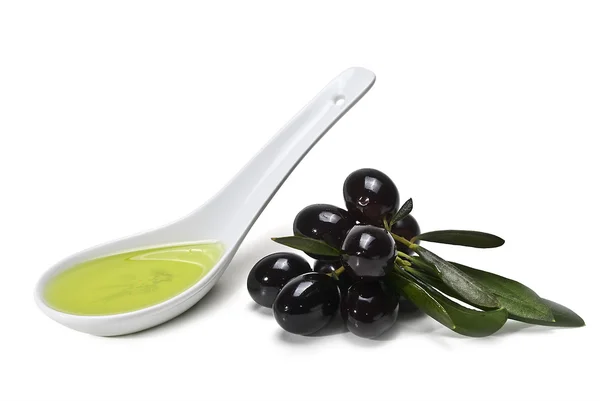 Spoonful of oil and olives. — Stock Photo, Image