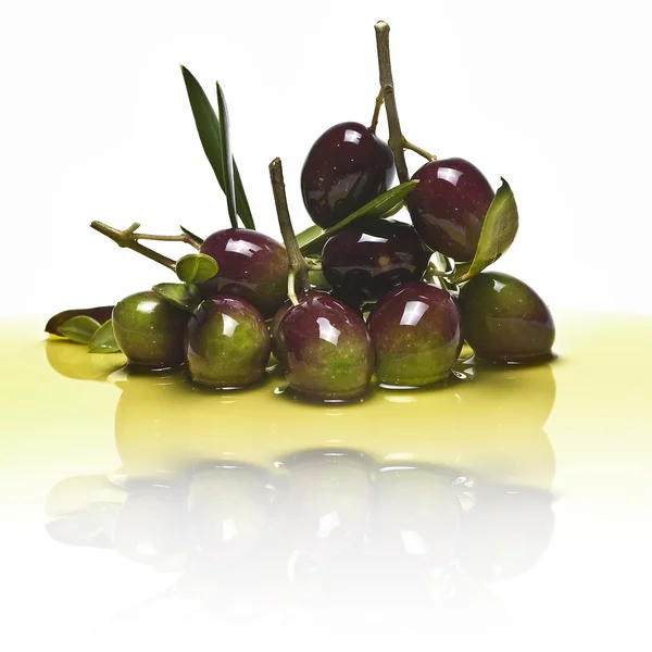 Olives and oil reflected. — Stock Photo, Image