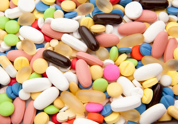 Fondo hecho de píldoras de colores — Foto de Stock