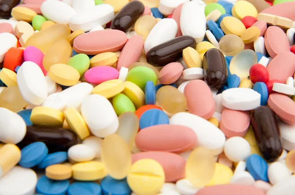 Fundo feito de pílulas coloridas — Fotografia de Stock