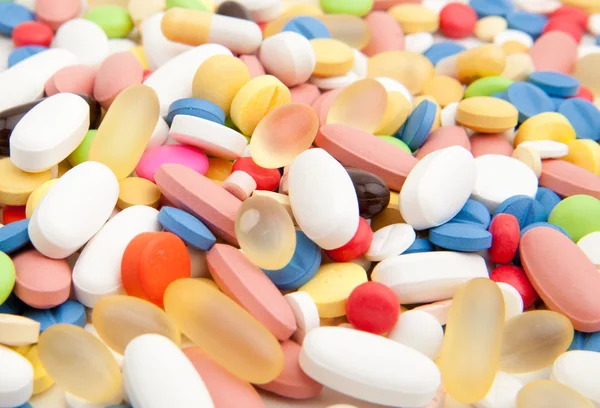 Bakgrunn av fargerike piller – stockfoto